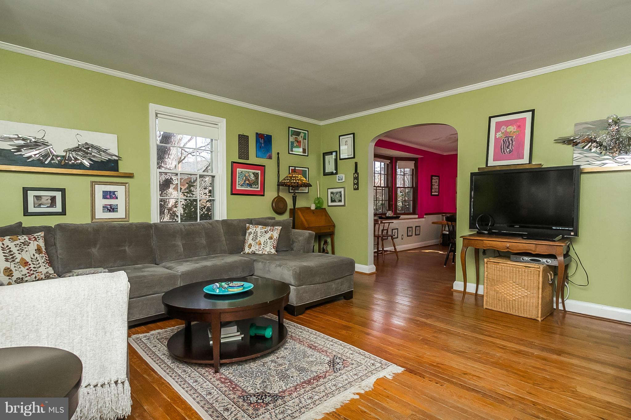 7051 Heathfield Road Baltimore, MD 21212 - Photo 4 of 17 a living room with furniture and a flat screen tv