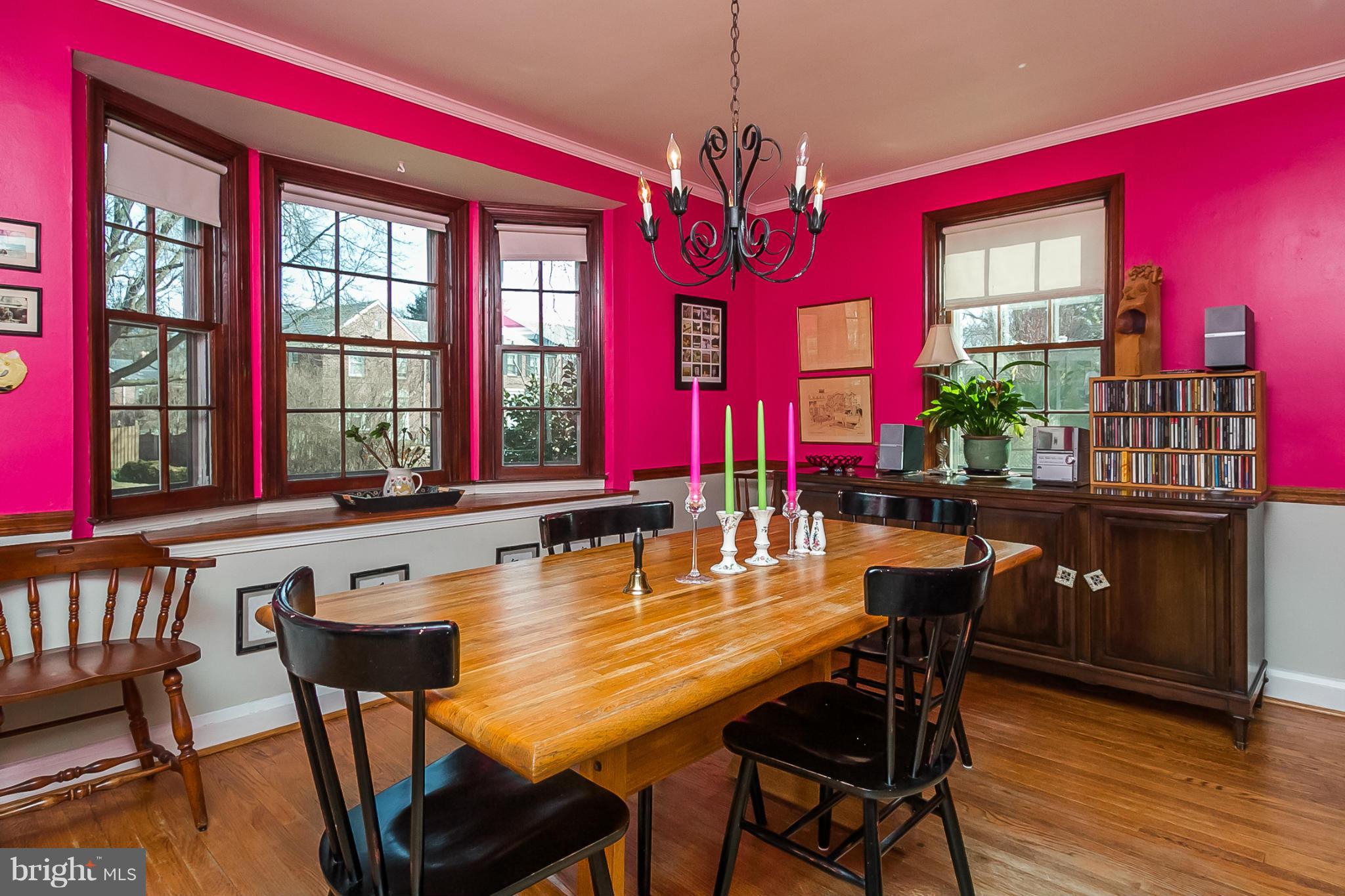 7051 Heathfield Road Baltimore, MD 21212 - Photo 5 of 17 a dining room with furniture a chandelier and wooden floor