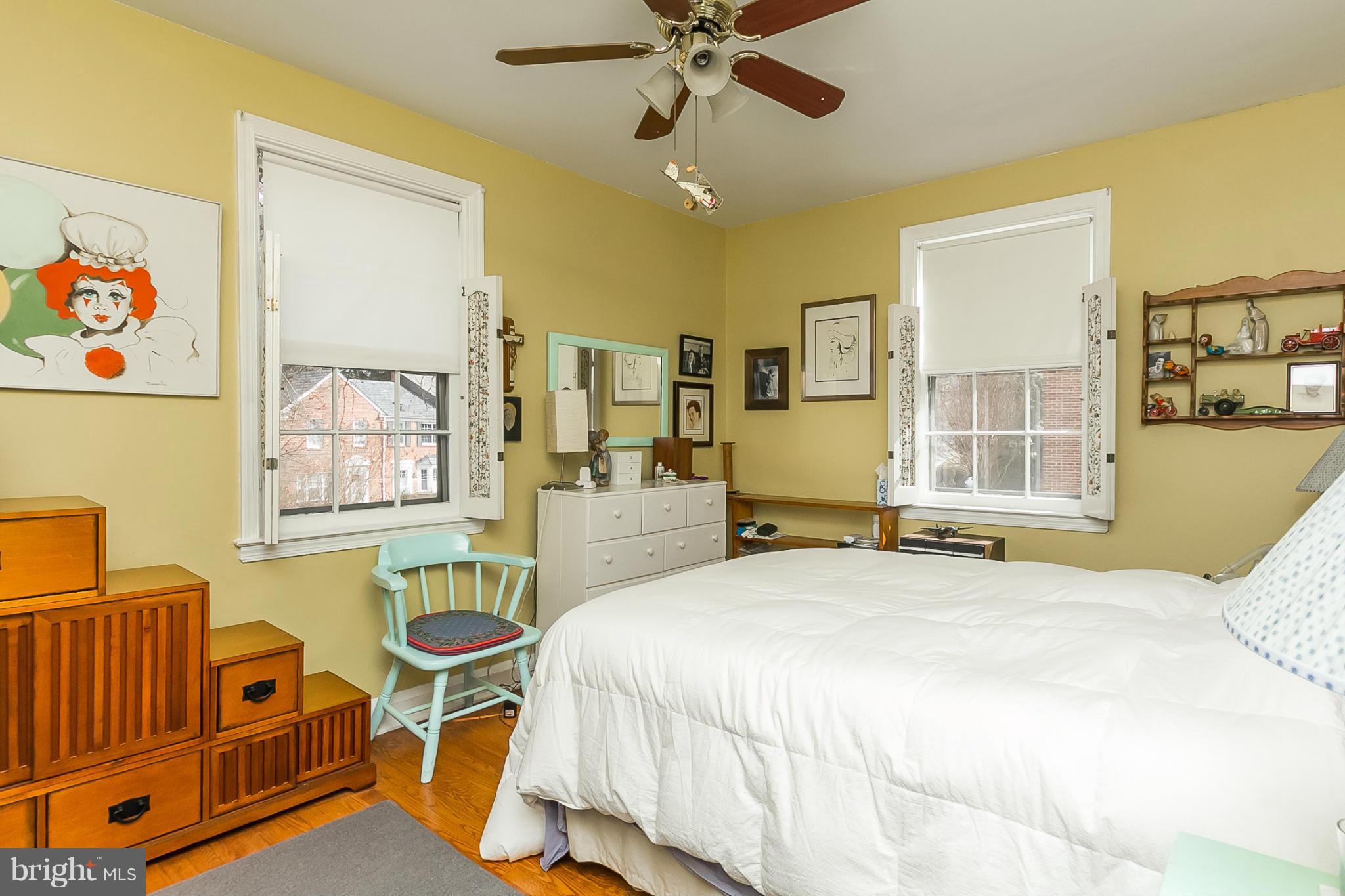 7051 Heathfield Road Baltimore, MD 21212 - Photo 10 of 17 a bedroom with a bed and wooden floor