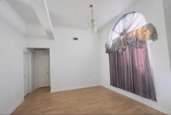 a view of a livingroom with wooden floor