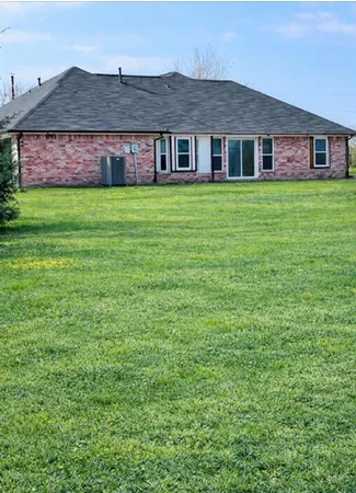 a big house with a big yard and more windows