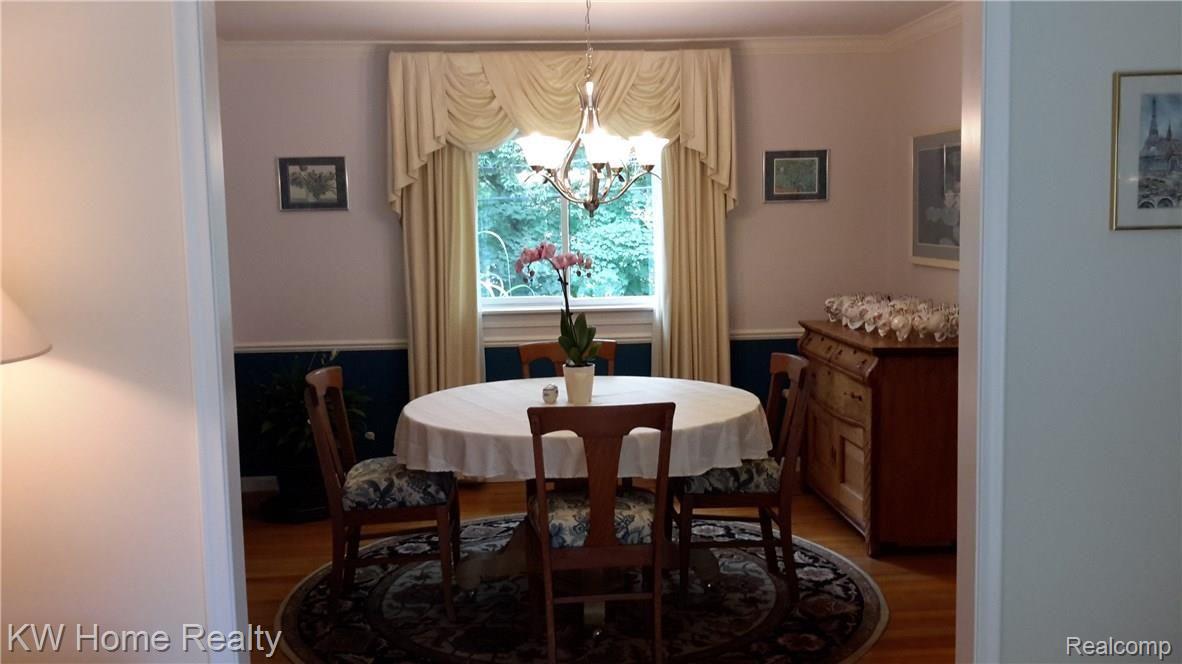 44711 Brookside Road Plymouth, MI 48170 - Photo 14 of 45 Dining room with hardwood floors and custom drapes