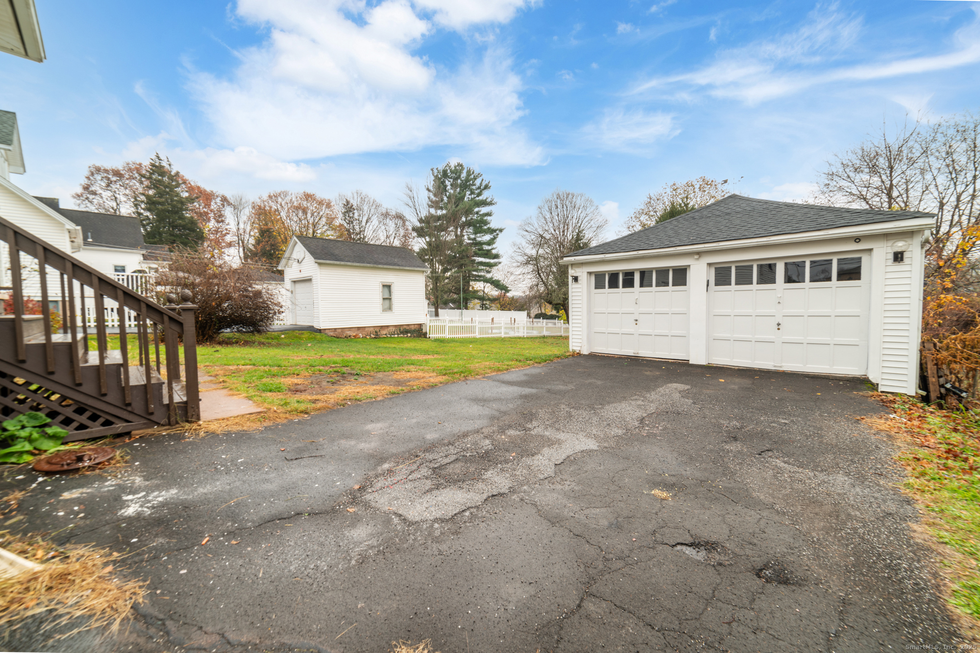 187 Ridge Road Middletown, CT 06457 - Photo 2 of 16 a view of a house with a big yard and large trees