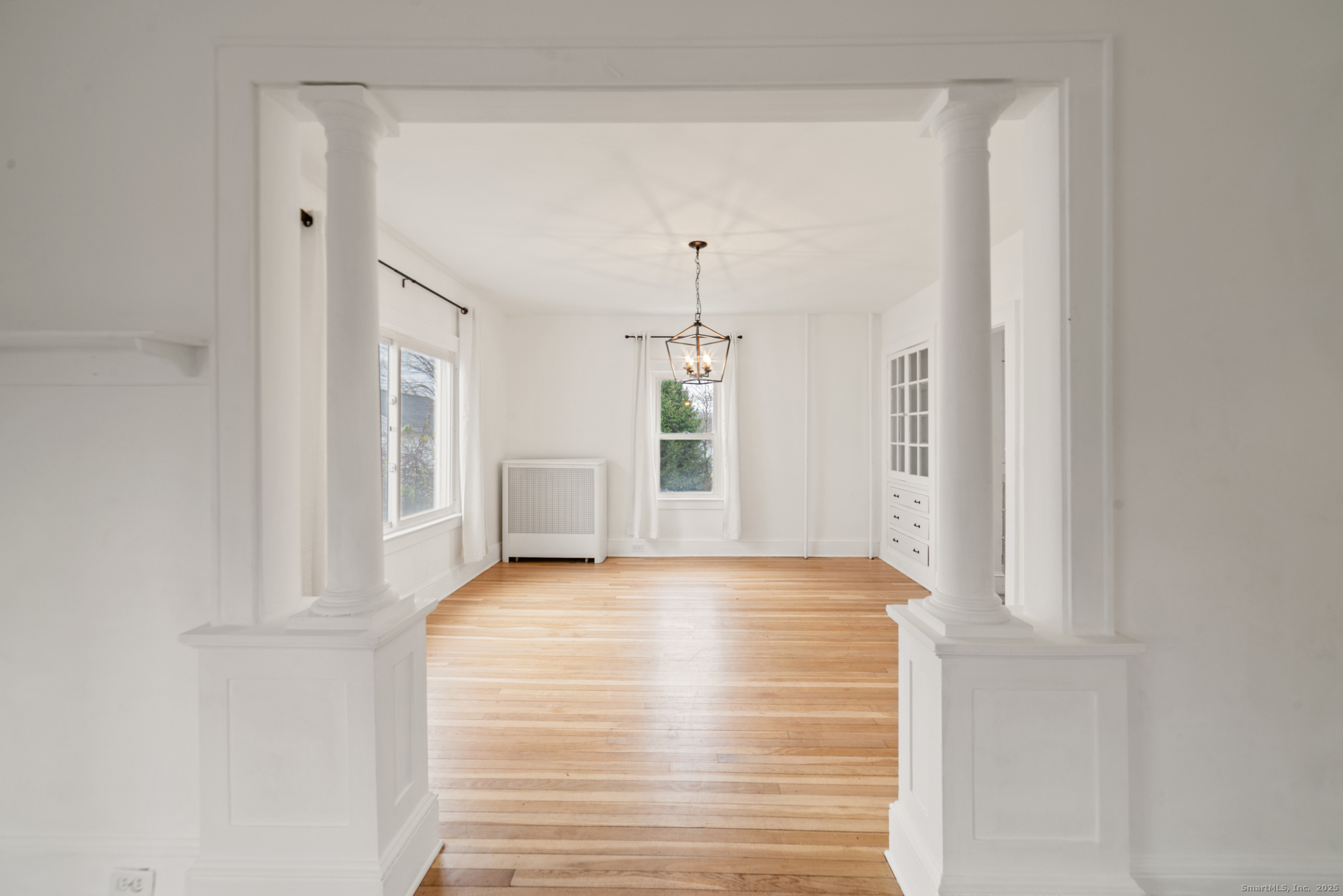 187 Ridge Road Middletown, CT 06457 - Photo 8 of 16 a view of a livingroom with wooden floor and a window