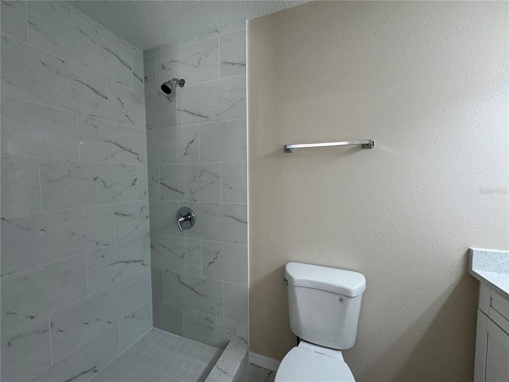 2527 Ridge Top Way Valrico, FL 33594 - Photo 15 of 29 a bathroom with a toilet and a shower