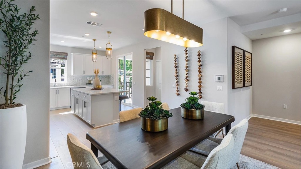 8397 Tapia Way Rancho Cucamonga, CA 91730 - Photo 5 of 22 a dining room with furniture and wooden floor