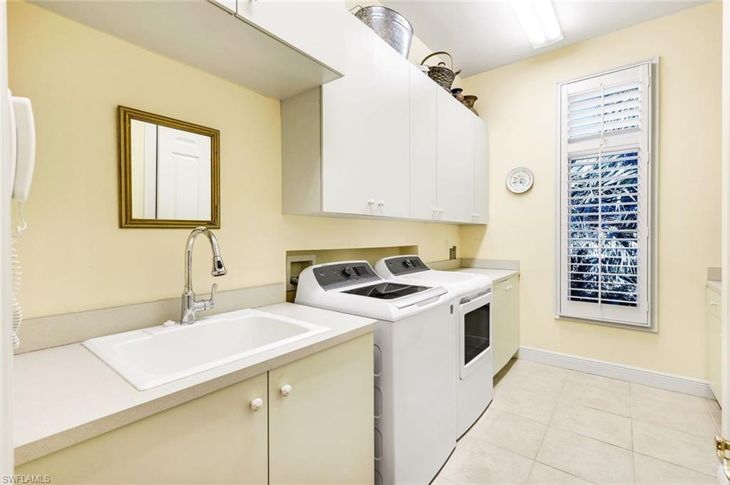 1468 Gormican Lane Naples, FL 34110 - Photo 27 of 36 a view of a kitchen with sink washer and dryer