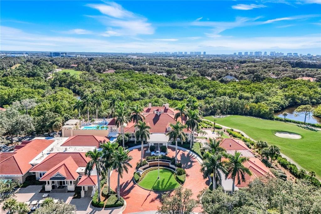 1468 Gormican Lane Naples, FL 34110 - Photo 28 of 36 an aerial view of residential houses with outdoor space and trees