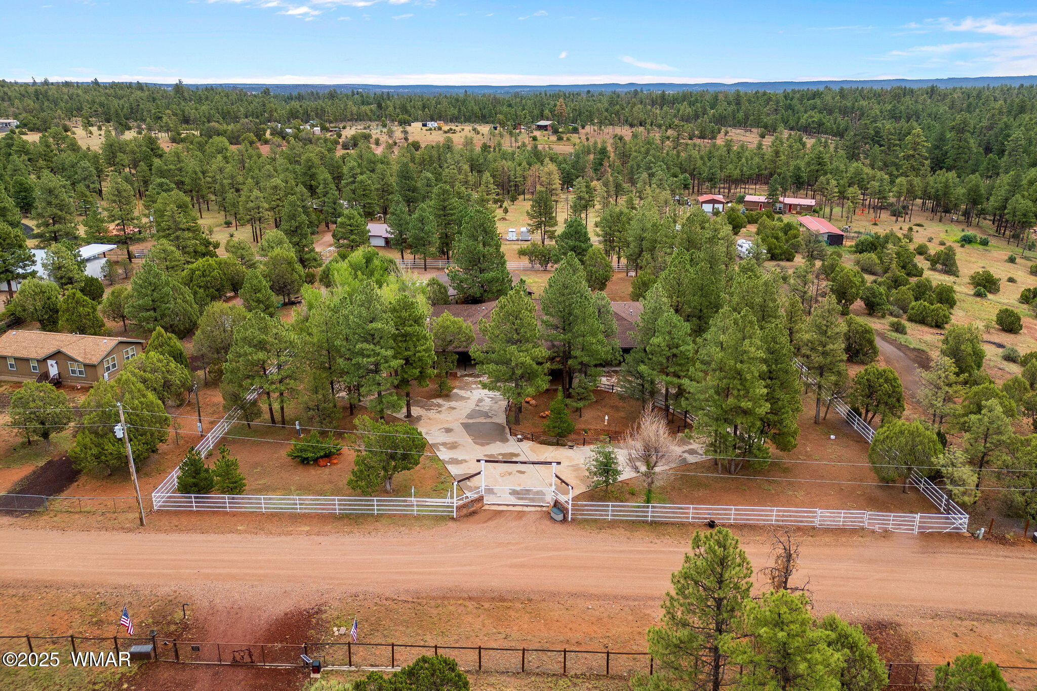 1955 Ricochet Ranch Road Show Low, AZ 85901 - Photo 42 of 43 an aerial view of residential houses with outdoor space and trees