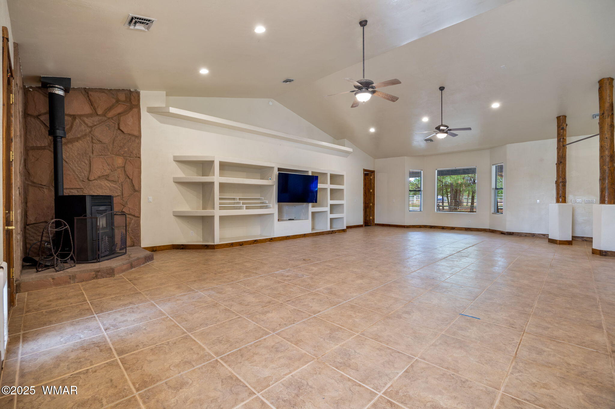 1955 Ricochet Ranch Road Show Low, AZ 85901 - Photo 9 of 43 a view of a livingroom with a fireplace cabinets and window