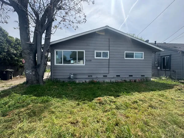 a backyard of a house with lots of green space