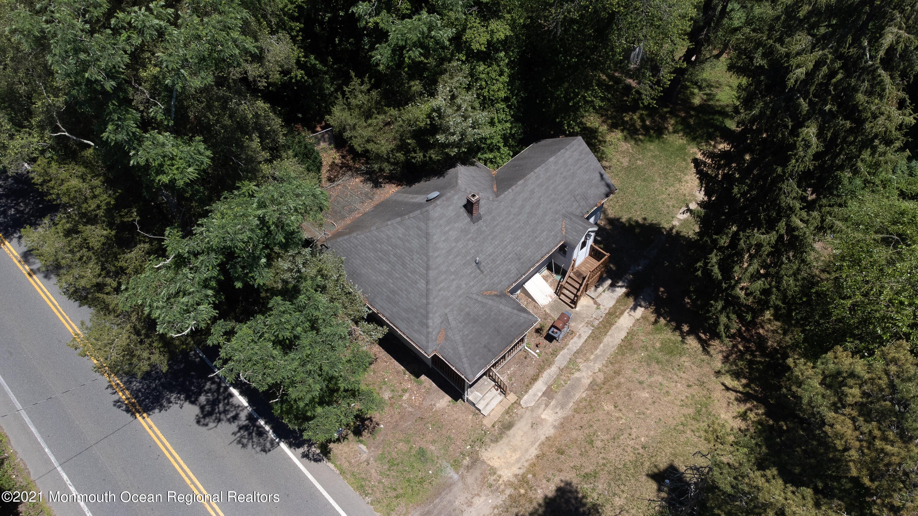 61 Cassville Road Jackson, NJ 08527 - Photo 24 of 26 an aerial view of a house with a yard and trees all around
