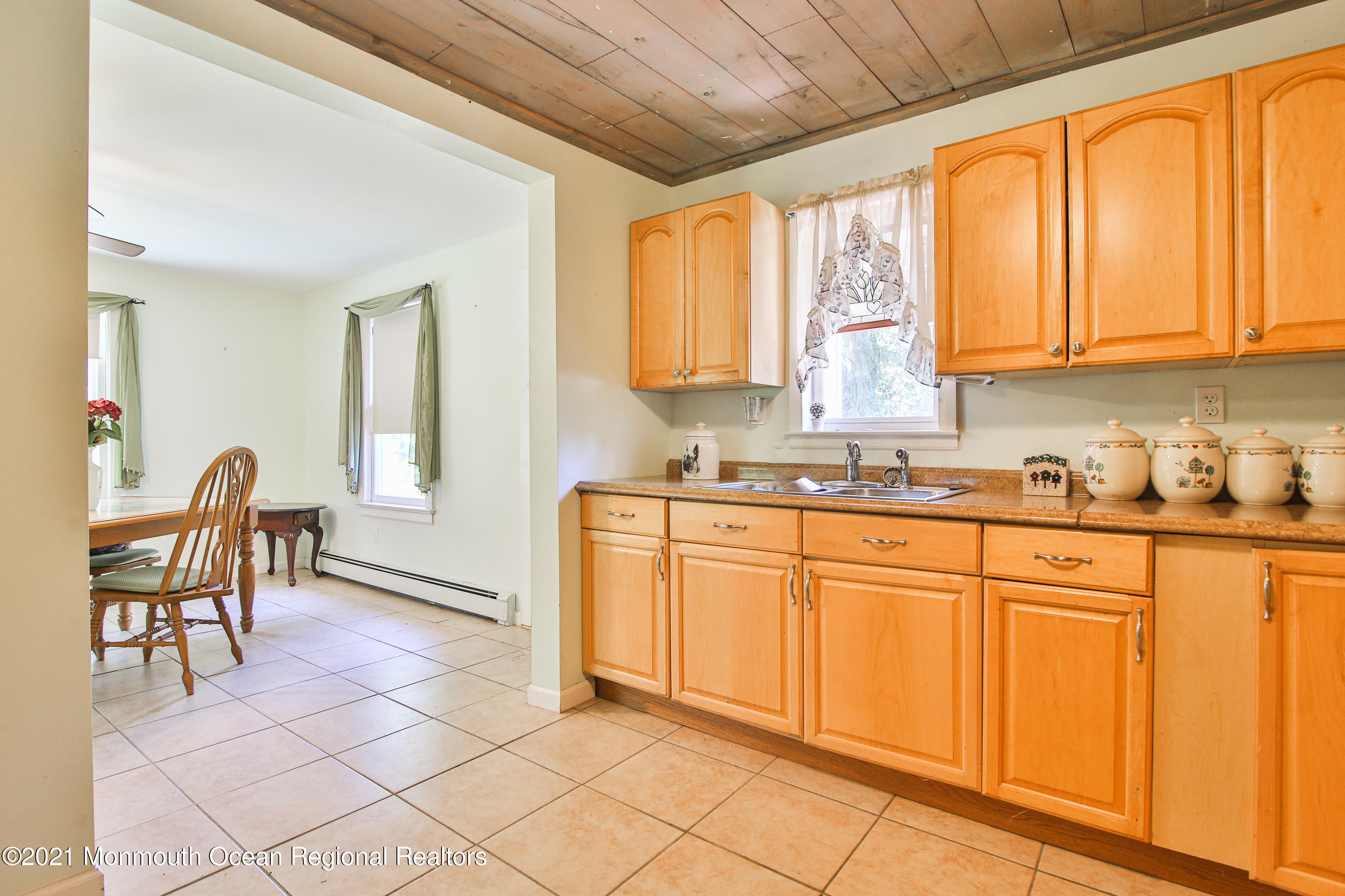 61 Cassville Road Jackson, NJ 08527 - Photo 6 of 26 a kitchen with a sink cabinets and dining table chair
