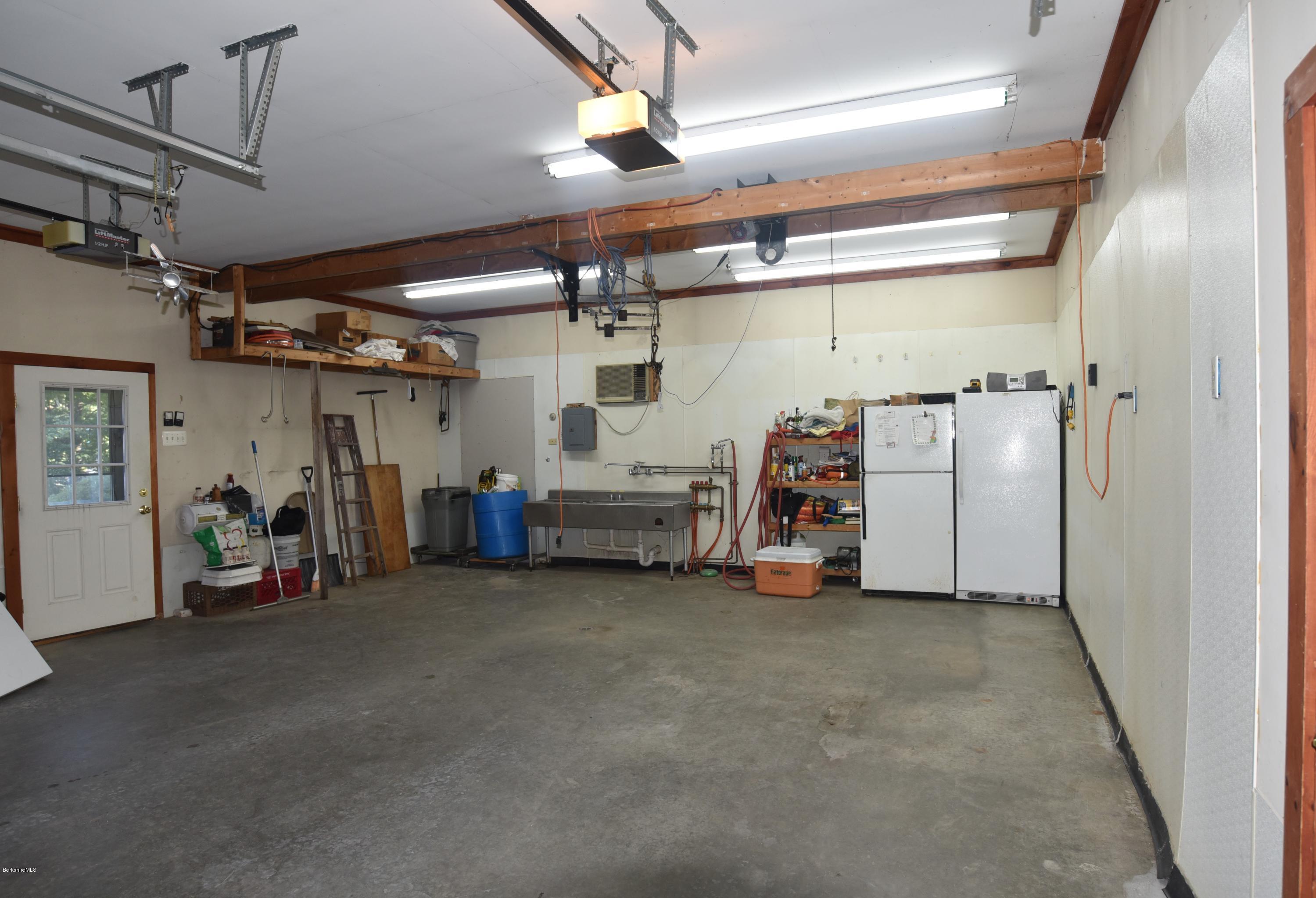 137 West Center Road Otis, MA 01253 - Photo 14 of 27 a view of a garage with storage