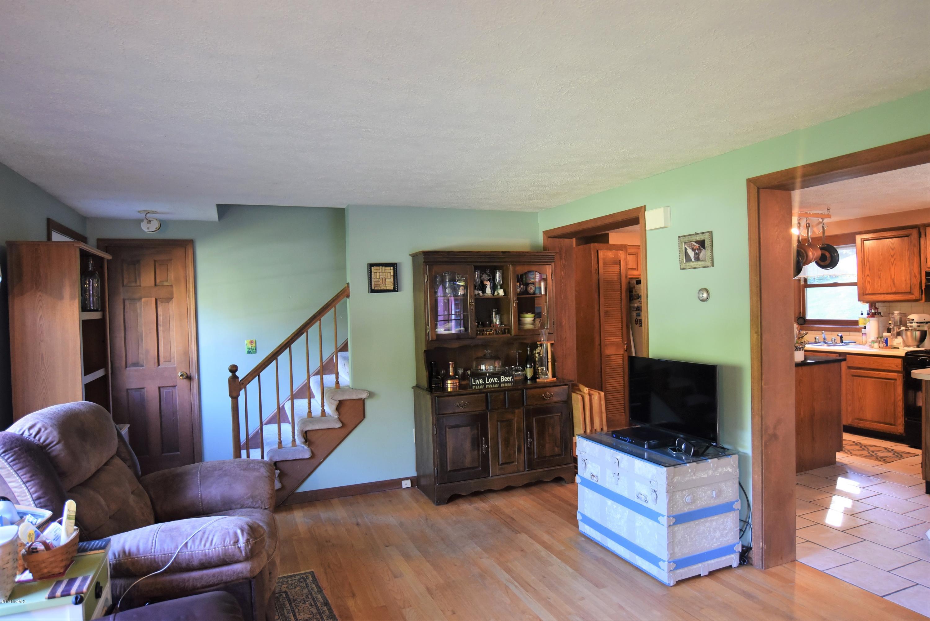 137 West Center Road Otis, MA 01253 - Photo 4 of 27 a living room with furniture and a flat screen tv