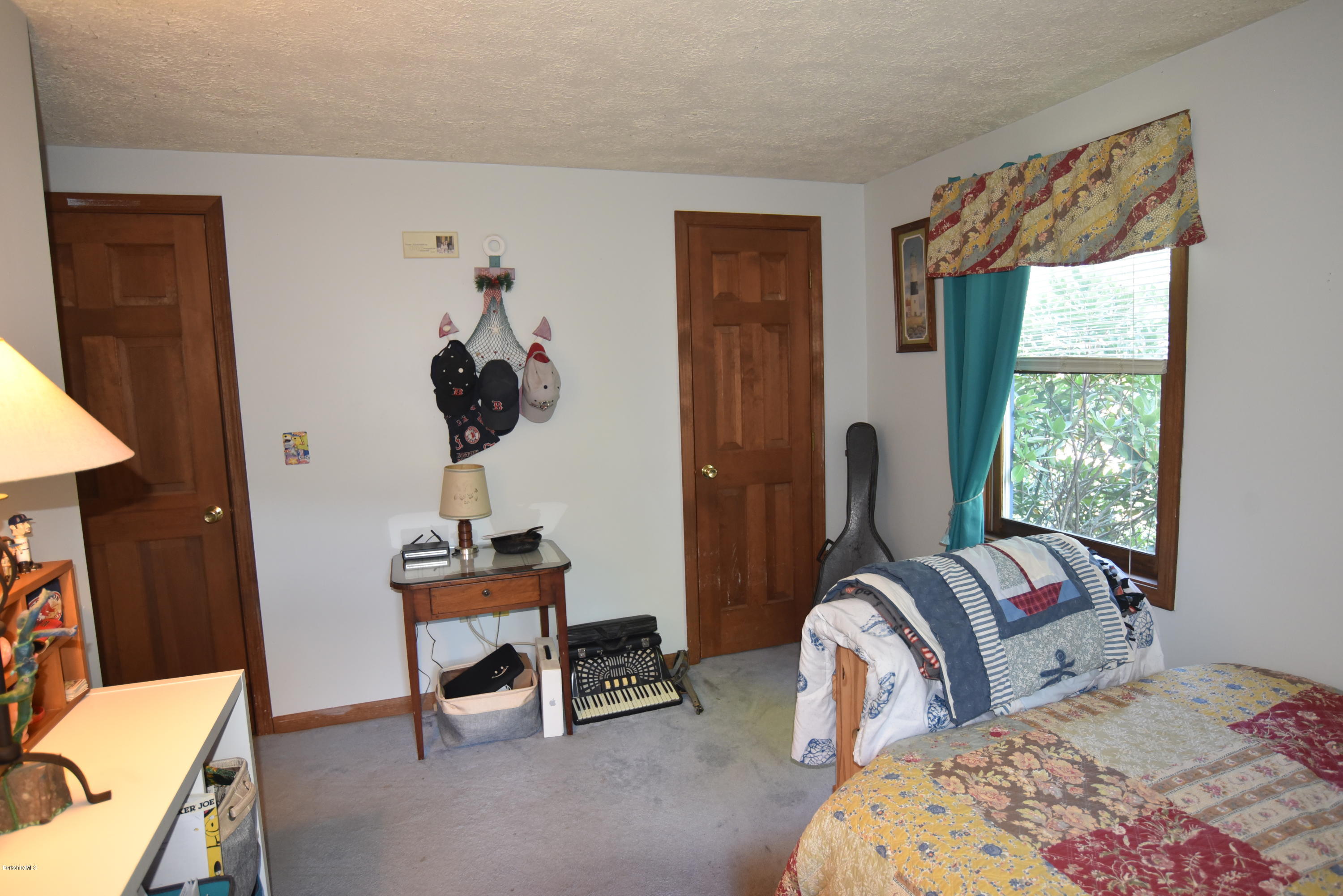 137 West Center Road Otis, MA 01253 - Photo 8 of 27 a bedroom with a bed and a window
