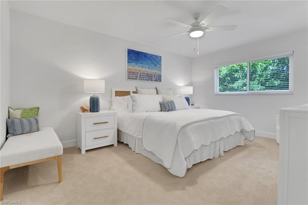 4160 Crayton Road, Unit A4 Naples, FL 34103 - Photo 11 of 23 a bedroom with bed and window