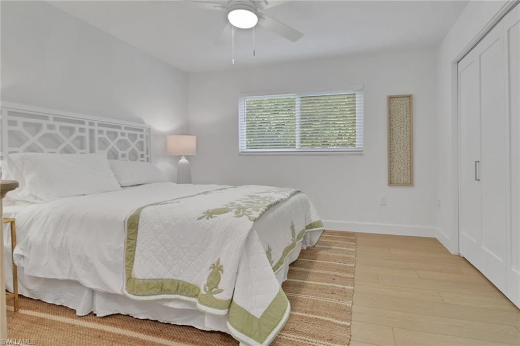 4160 Crayton Road, Unit A4 Naples, FL 34103 - Photo 14 of 23 a bedroom with a bed and window