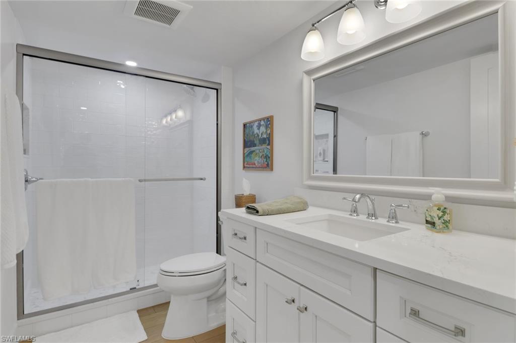 4160 Crayton Road, Unit A4 Naples, FL 34103 - Photo 15 of 23 a bathroom with a sink a toilet and shower