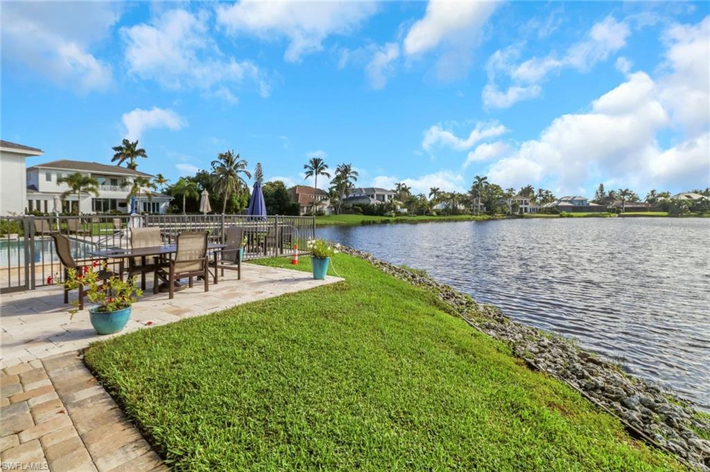 4160 Crayton Road, Unit A4 Naples, FL 34103 - Photo 16 of 23 a view of a lake with outdoor space