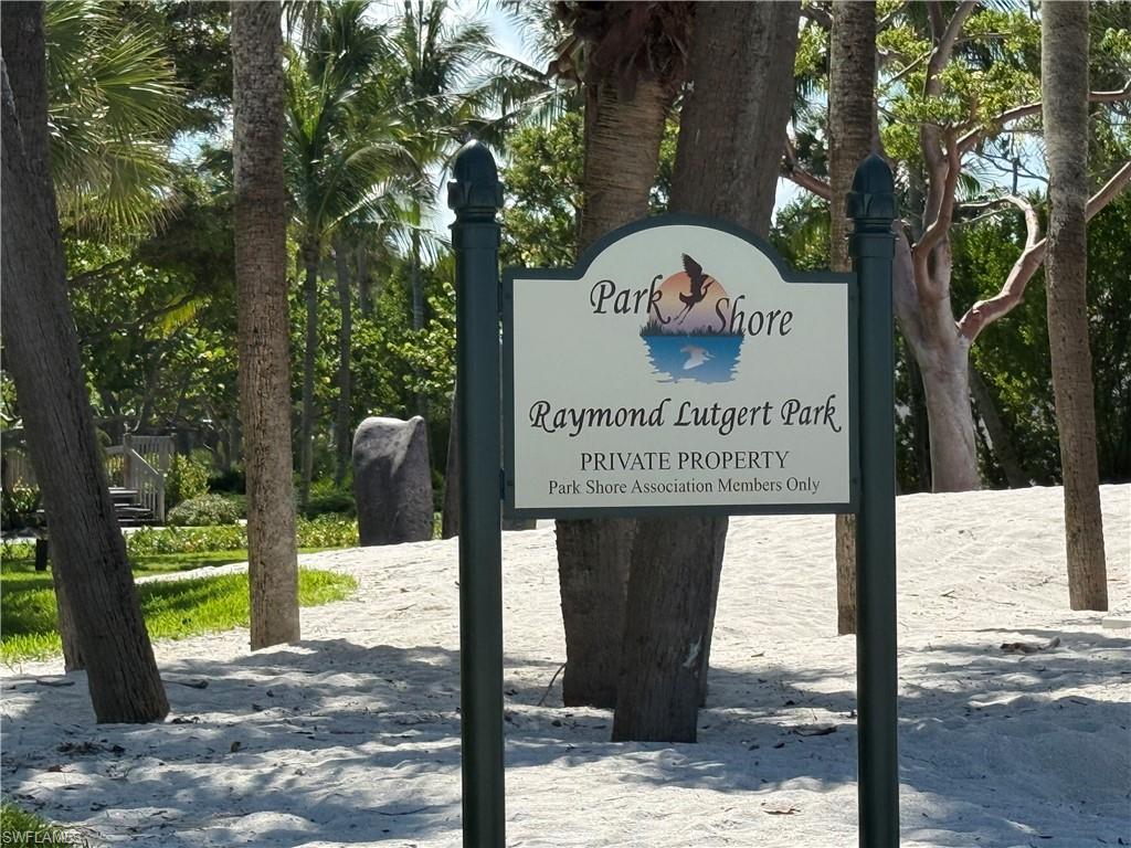 4160 Crayton Road, Unit A4 Naples, FL 34103 - Photo 20 of 23 a sign on the side of the road