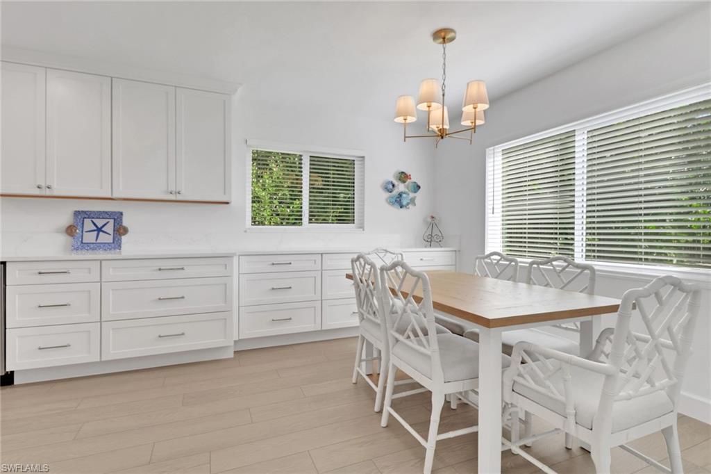 4160 Crayton Road, Unit A4 Naples, FL 34103 - Photo 5 of 23 a view of a dining room with furniture and window