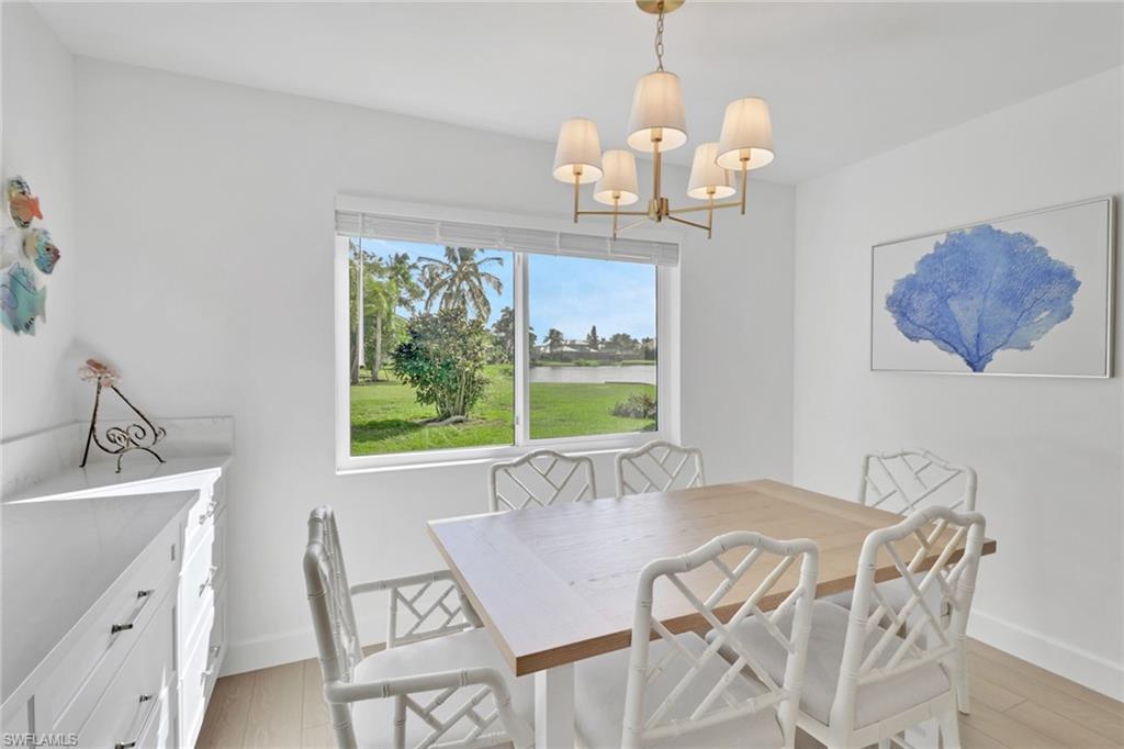 4160 Crayton Road, Unit A4 Naples, FL 34103 - Photo 6 of 23 a view of a dining room with furniture window and outside view