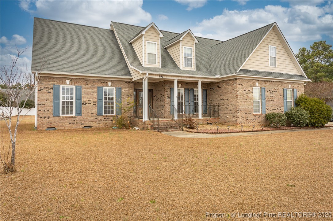 198 Grouse Run Raeford, NC 28376 - Photo 1 of 38 front view of a house with a yard
