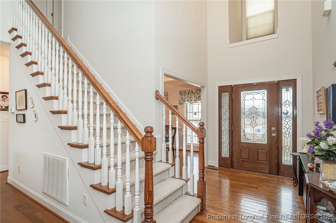 198 Grouse Run Raeford, NC 28376 - Photo 13 of 38 a view of entryway with wooden floor and stairs