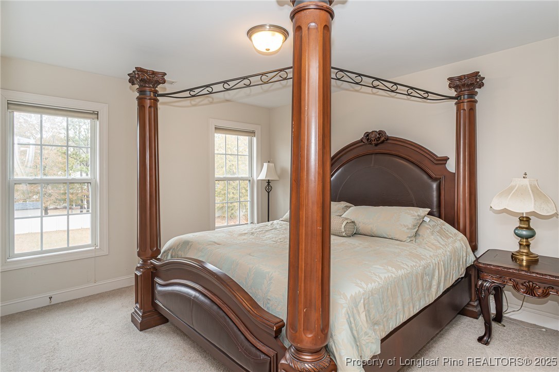 198 Grouse Run Raeford, NC 28376 - Photo 25 of 38 a bedroom with a bed and a window
