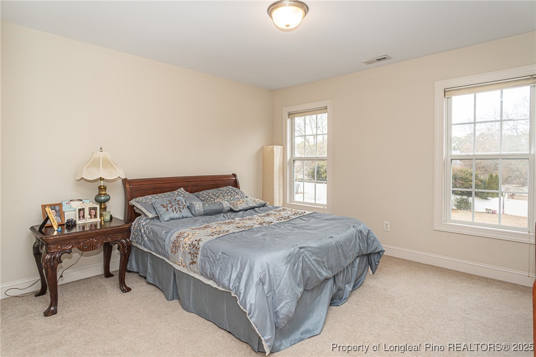198 Grouse Run Raeford, NC 28376 - Photo 26 of 38 a bedroom with a bed and a window