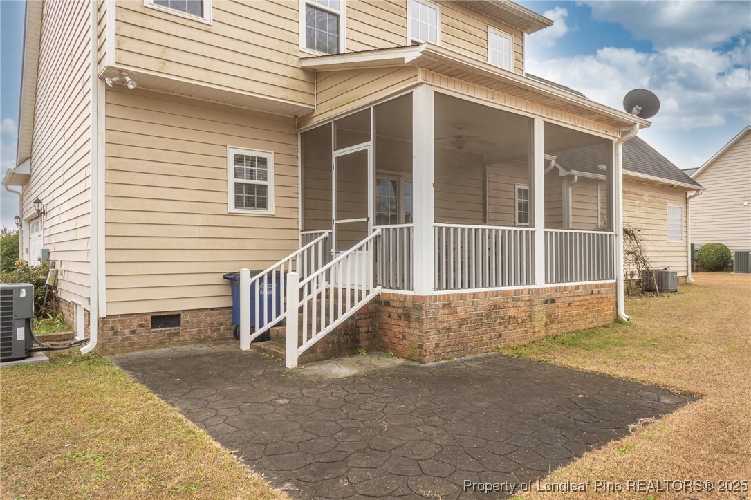 198 Grouse Run Raeford, NC 28376 - Photo 5 of 38 a view of a house with a floor to ceiling window and yard
