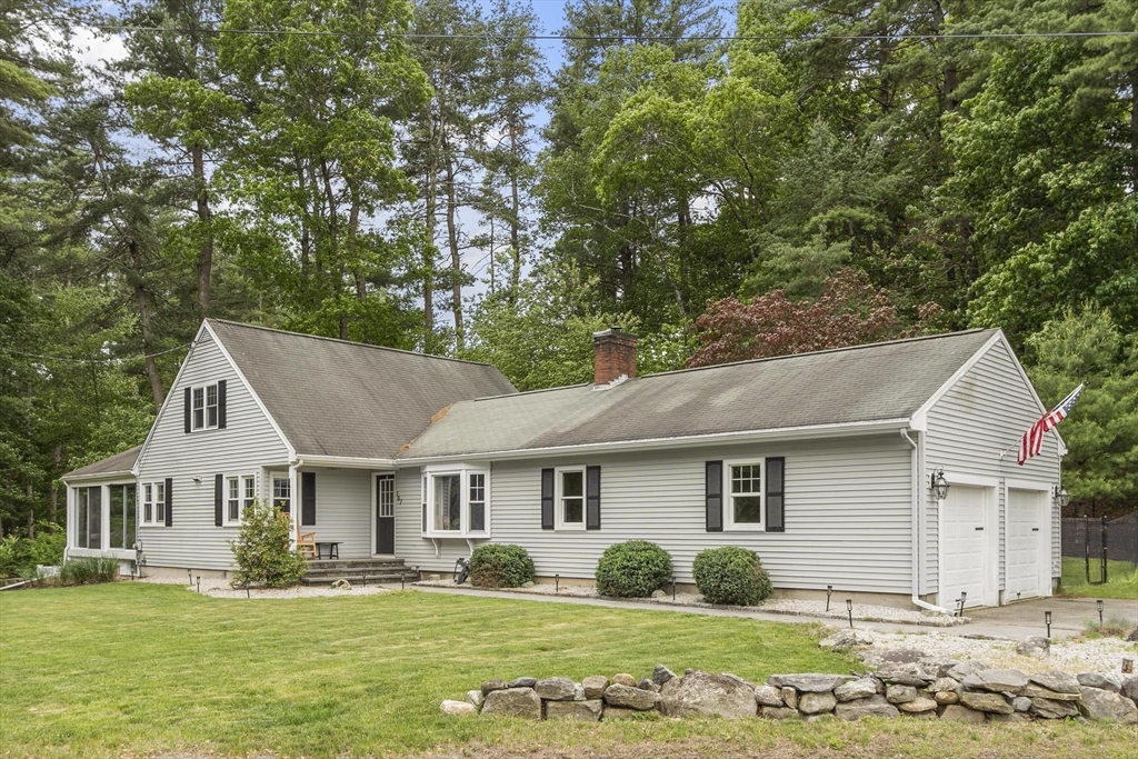 167 Gates Pond Road Berlin, MA 01503 - Photo 3 of 32 a front view of a house with a yard