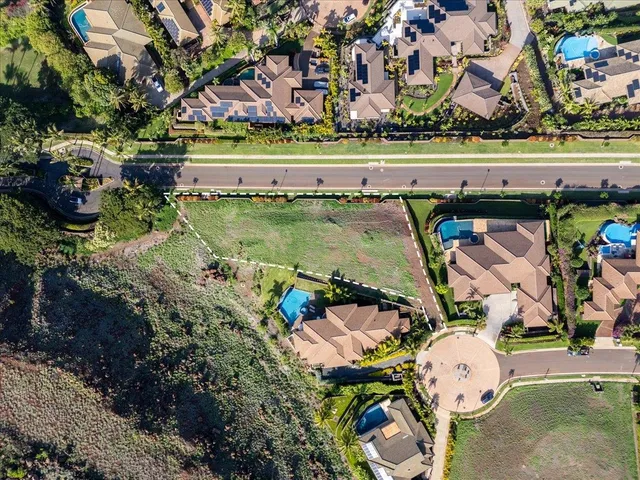 an aerial view of a house with a lake view