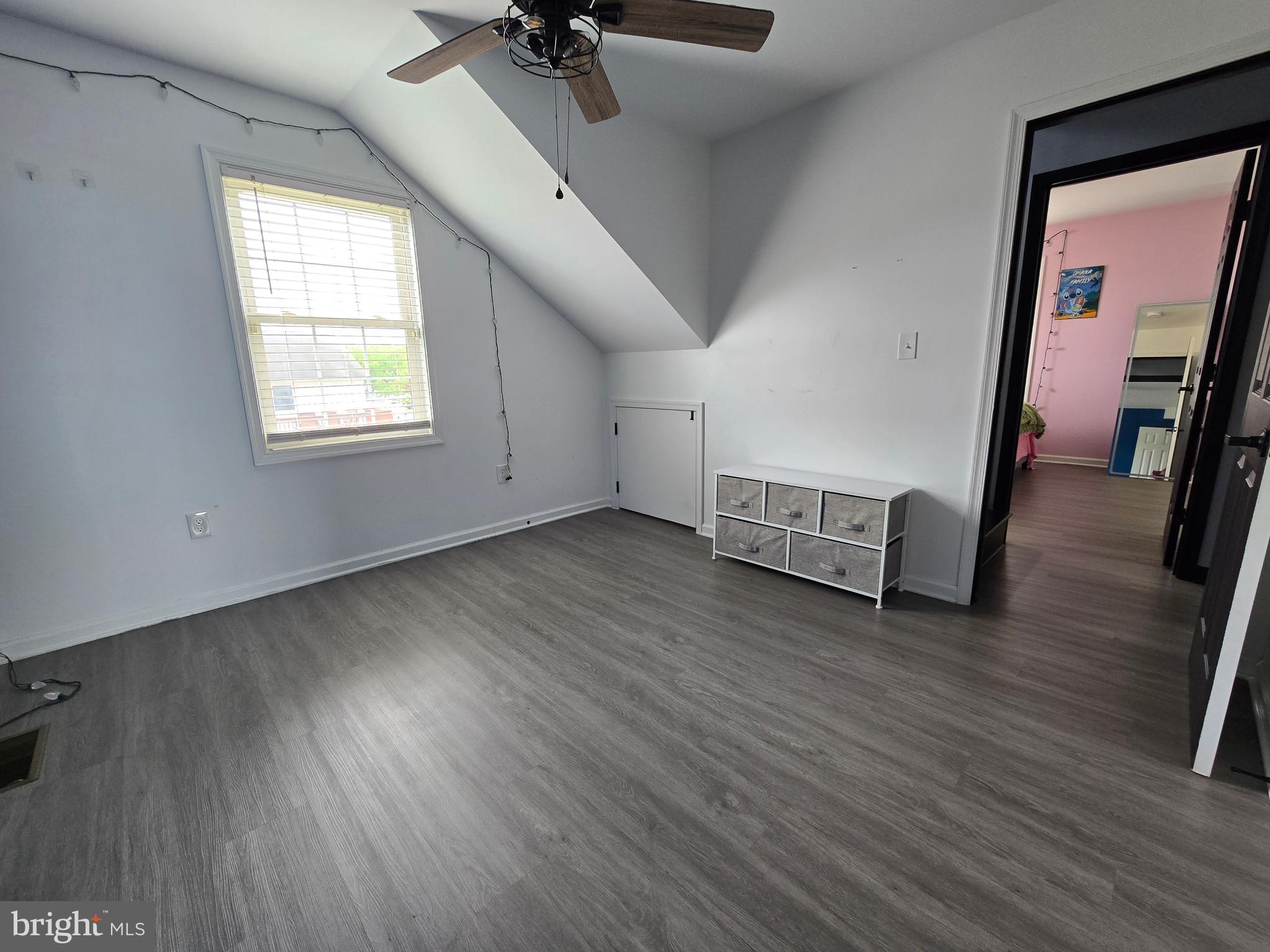 7513 Saffron Court Hanover, MD 21076 - Photo 19 of 42 wooden floor in an empty room with a window