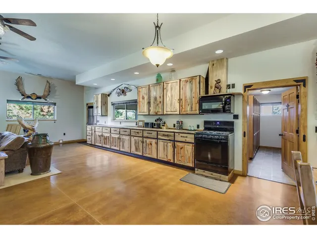a living room with lots of chairs and a table