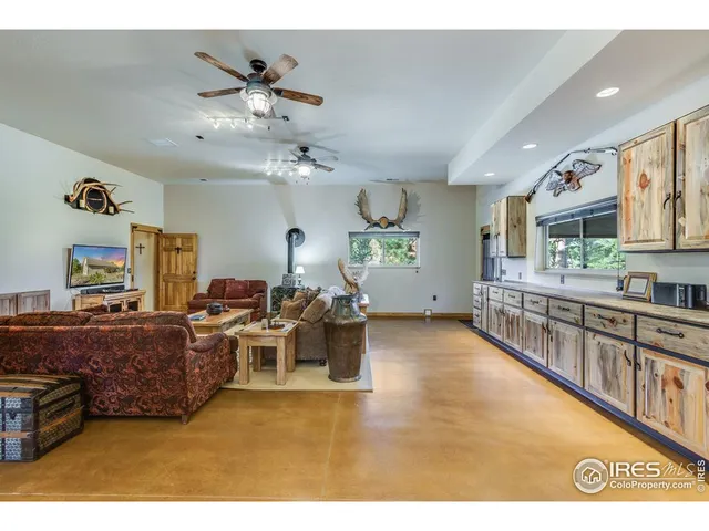 a living room with lots of furniture and a chandelier