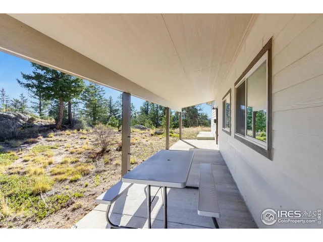 a view of a room with furniture and wooden floor
