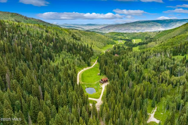a view of swimming pool with a yard