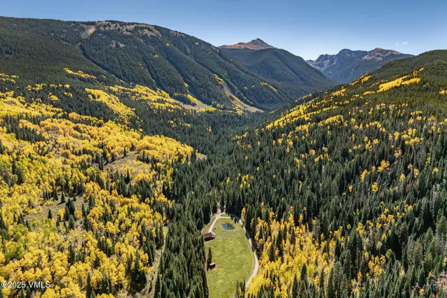 a view of a lake with a house in the background