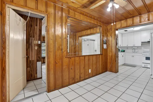 a view of a refrigerator and an empty room