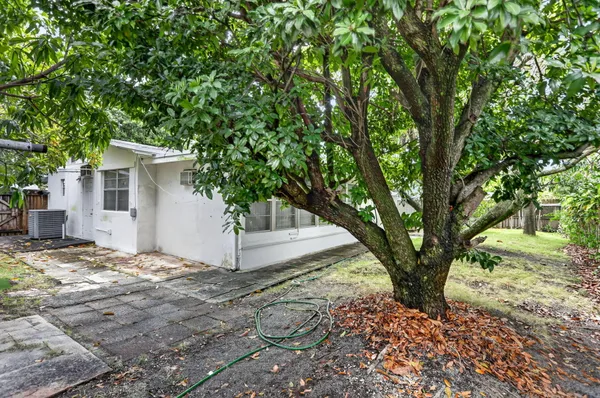a view of a house with a tree