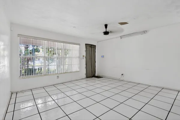 a view of an empty room and window