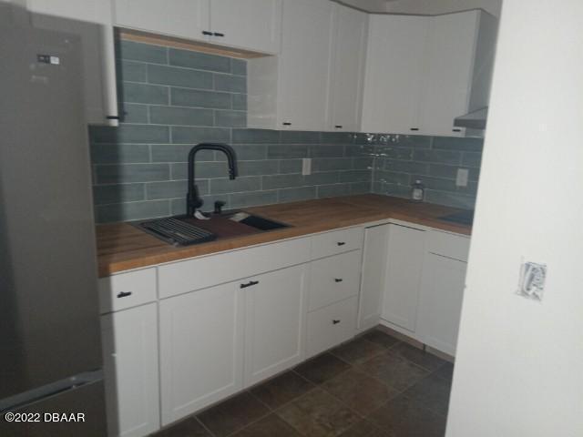4486 Daugharty Road DeLand, FL 32724 - Photo 22 of 23 a close view of a sink and cabinets