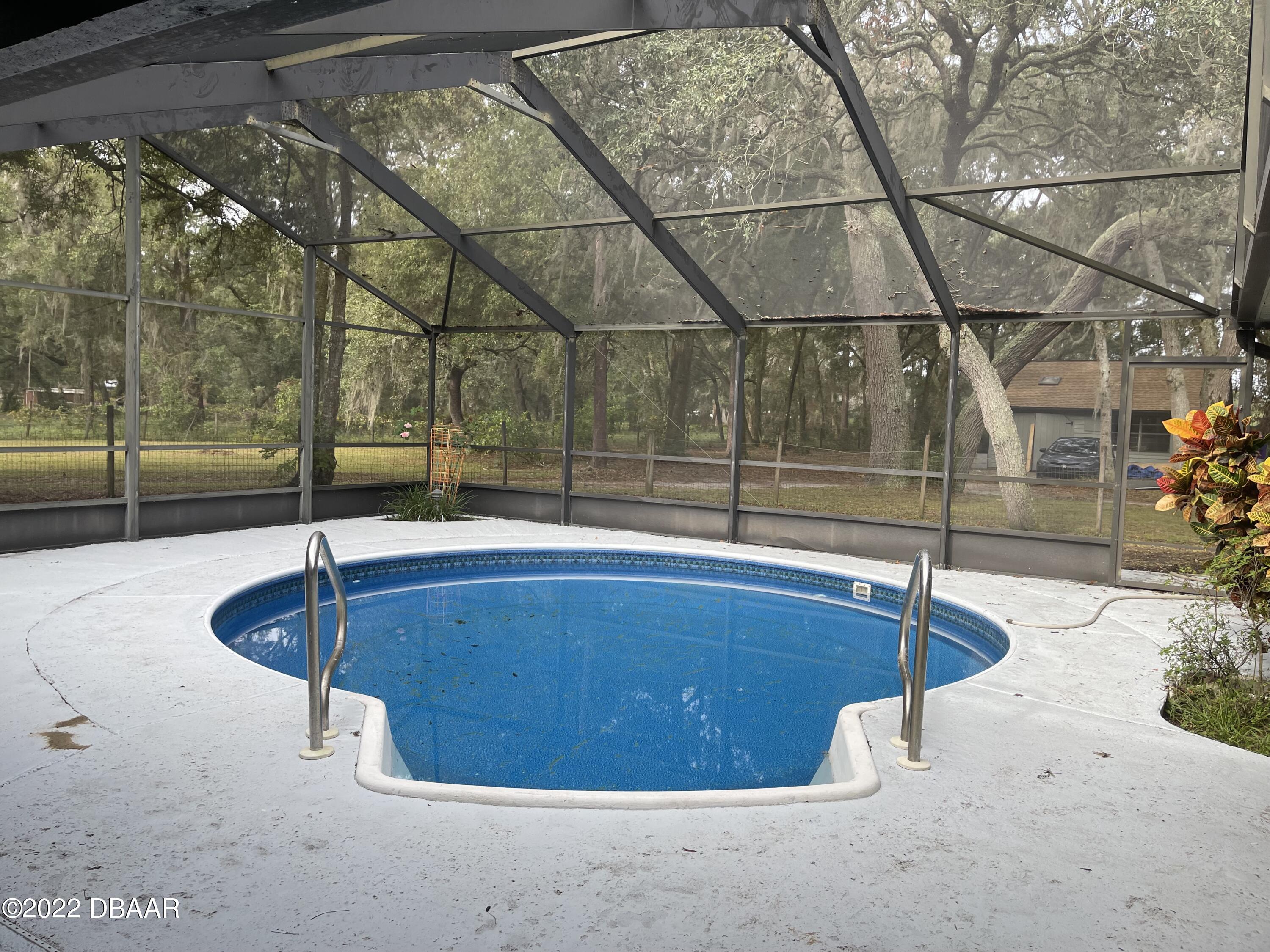4486 Daugharty Road DeLand, FL 32724 - Photo 8 of 23 a view of a indoor swimming pool