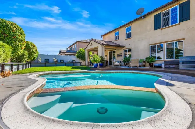 a view of outdoor space yard swimming pool and outdoor kitchen