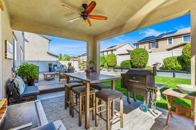 a living room with furniture dining area and a window