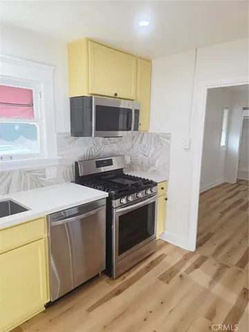 a kitchen with a stove and a sink