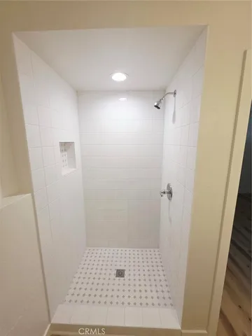 a view of a workspace with furniture and a potted plant
