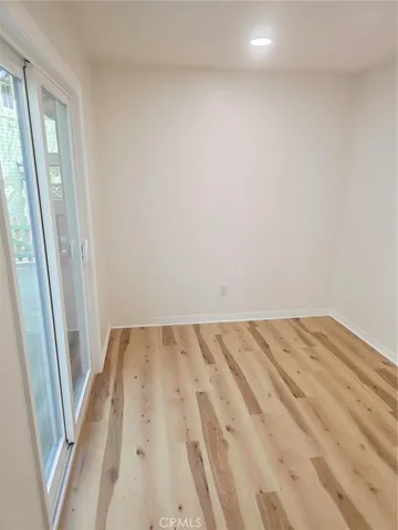 a view of a house with a wooden fence